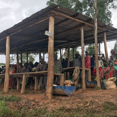 All hands on deck under the shade of the green coffee sorting area at the Nemba washing station. Workers hand pick out any visible defects before here before the coffee goes to the drying table, where the grading will continue.