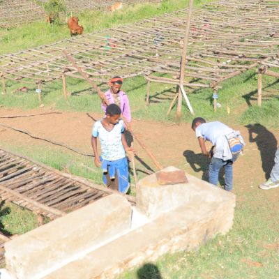 Constructing raised drying beds from wood and mesh, these raised tables will be covered in jute fiber where green coffee and whole cherries will be laid to dry. Genji Challa site, Gera, Jimma, Ethiopia.