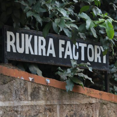 Hand-painted sign that reads, "Rukira Factory", at Rukira green coffee washing station in Othaya, Nyeri, Kenya.
