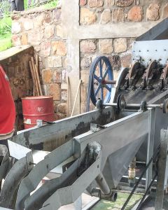 A disc depulper machine, used to remove the coffee cherry and fruit from the green coffee seed, at the Tumba coffee cooperative in Rulindo, Rwanda.