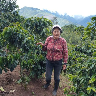 Sonia stands next to her coffee at La Loma.